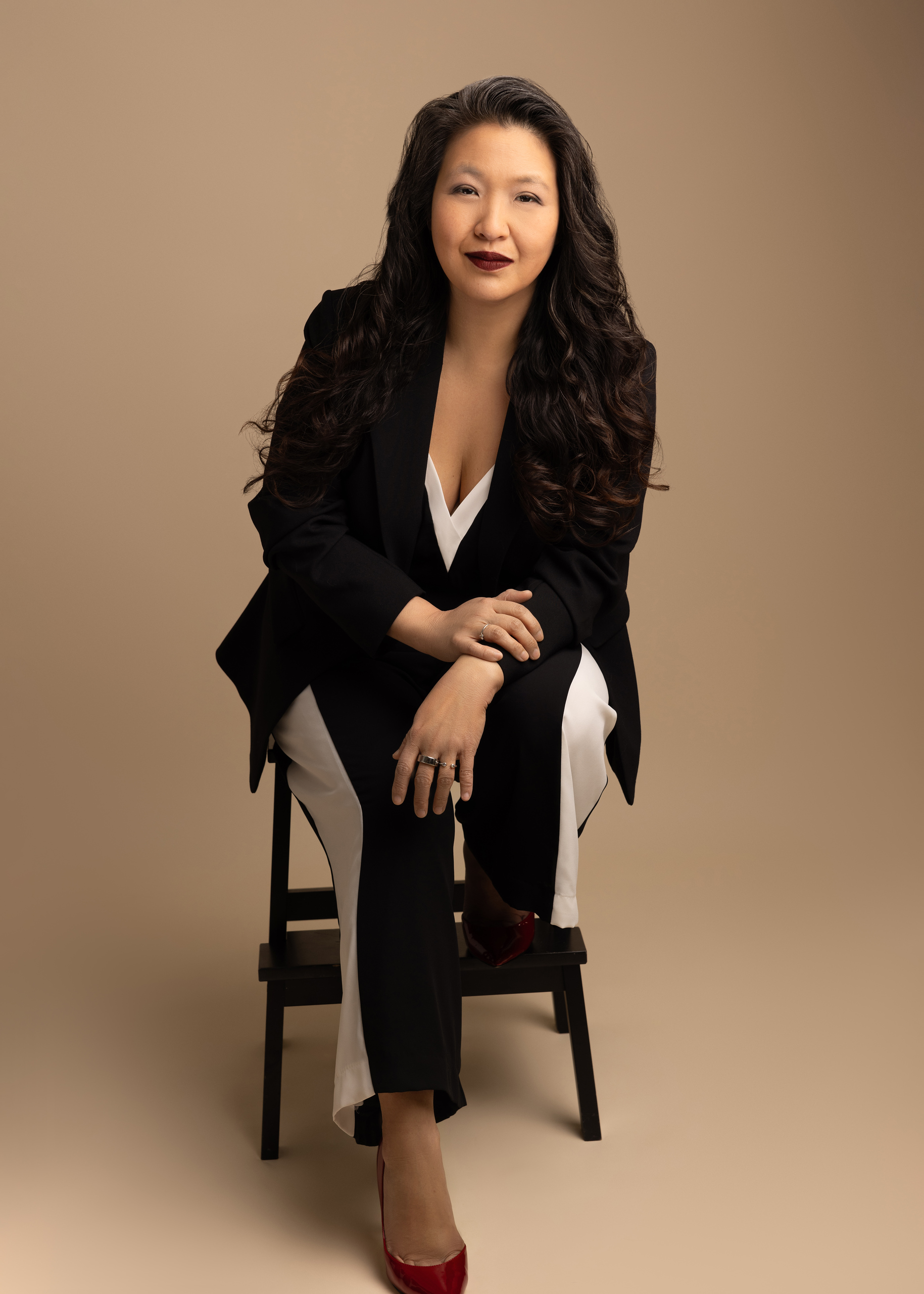 Dr. Lillian Liang Emlet seated for a professional portrait